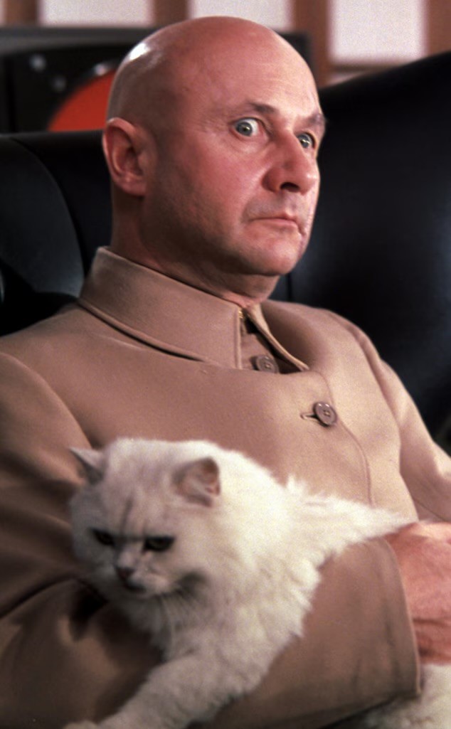 Blofeld, played by Donald Pleasence, seated with his white cat in You Only Live Twice.